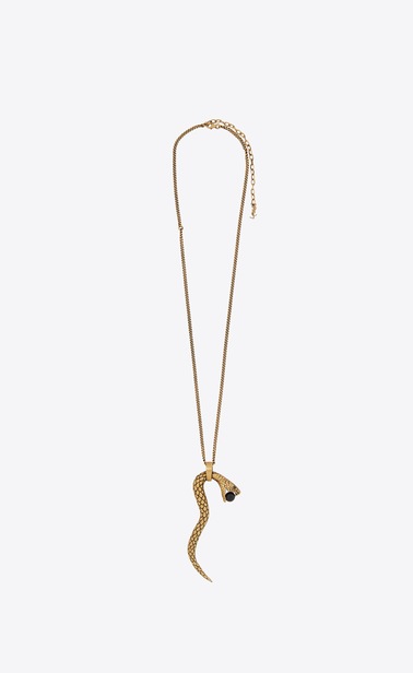 Pendentif SERPENT en métal doré et perle de verre noire.